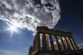 A sunstar is shown against the deep blue Greek sky above the Parthenon of Athens. Royalty Free Stock Photo